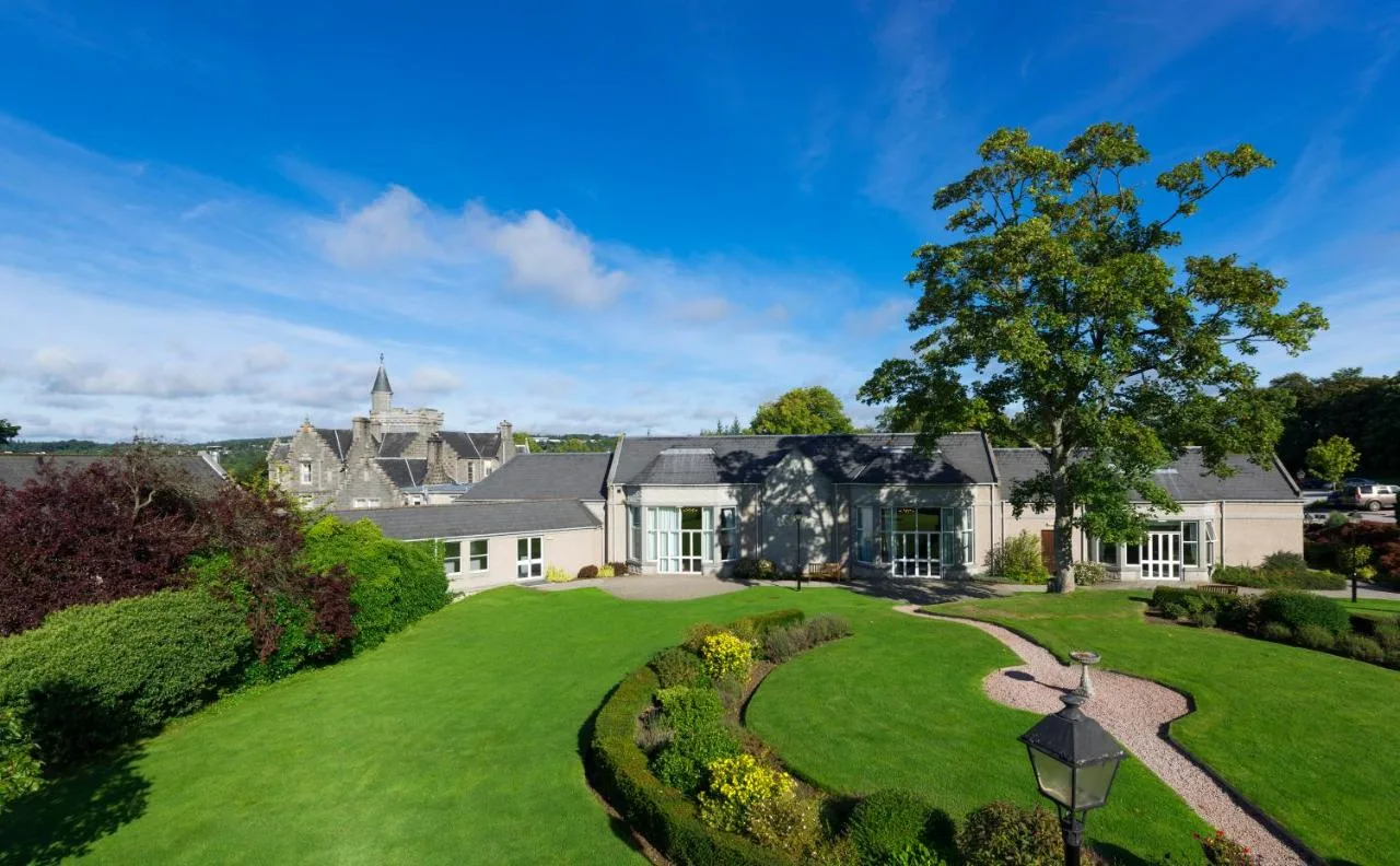 Exterior view of the Victorian mansion and garden at Ardoe House Hotel & Spa